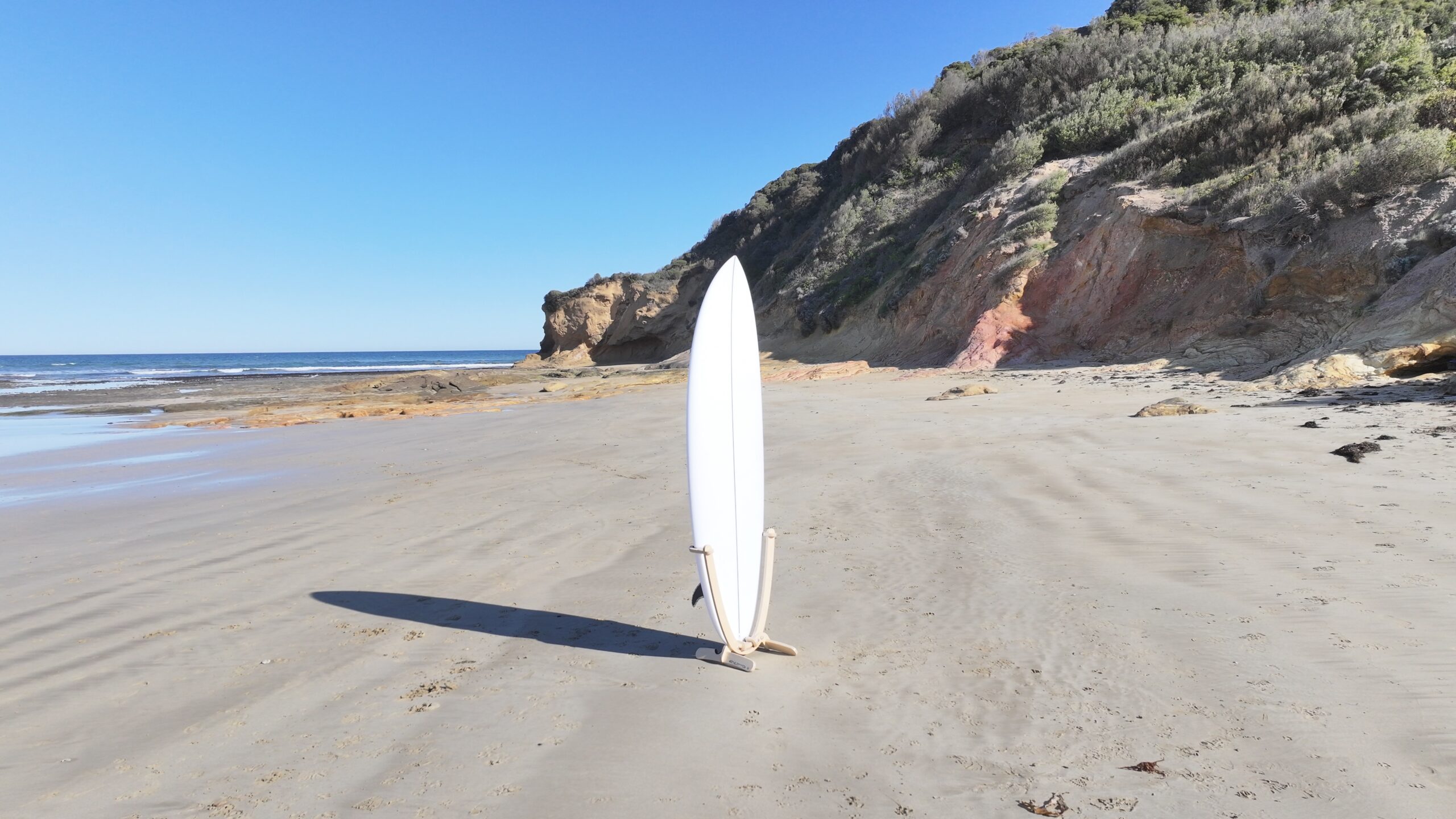 GLYD O Revolute vertical surfboard rack angle view Urquharts Bluff cliffs.
