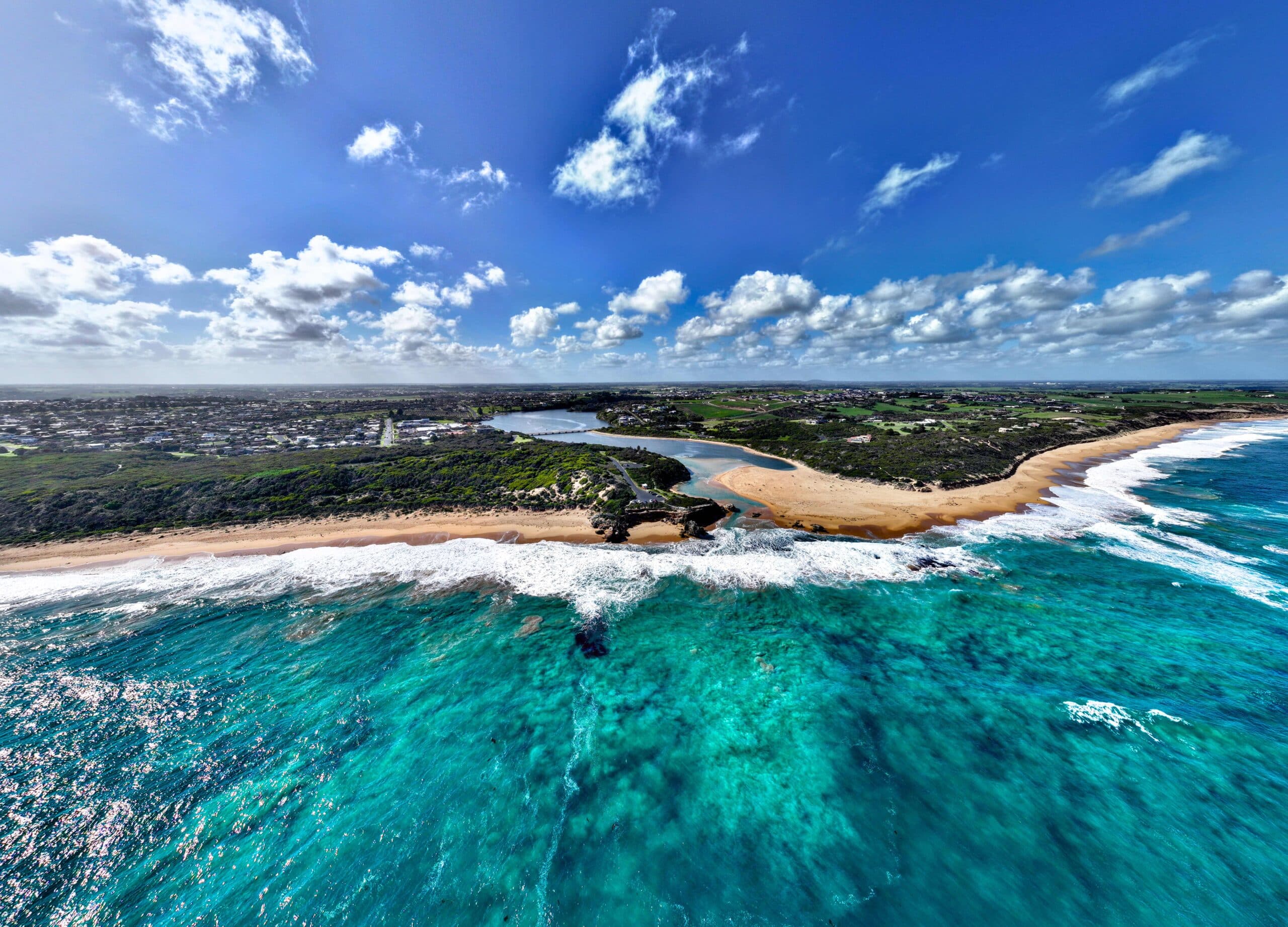Aerial view of Point Ritchie in Warrnambool's stunning coastline, with turquoise waters ideal for surfing and a Freestanding Surfboard Display Stand.